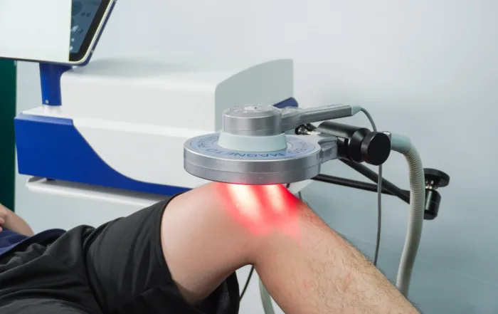 Patient receiving EMTT therapy treatment to help reduce joint pain and improve mobility
